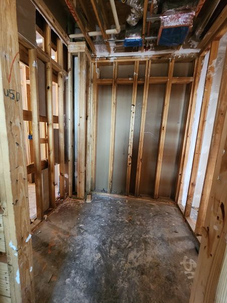 Bare framed interior of a room, showing the construction phase at Congress Lofts Saint Elmo by Intracorp (Austin, TX).