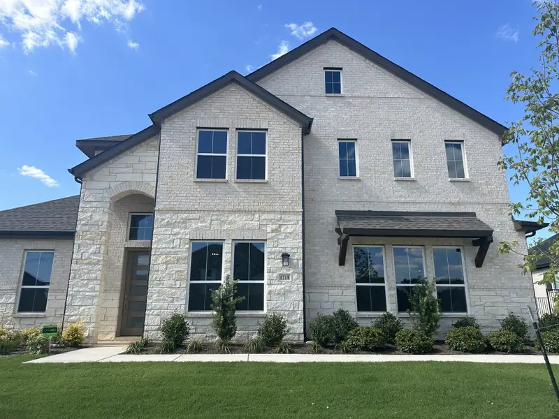 A beautiful stone-clad home with manicured landscaping in Eagle Estates by GFO Home (Mansfield, TX). A beautiful stone-clad home with manicured landscaping in Eagle Estates by GFO Home (Mansfield, TX).