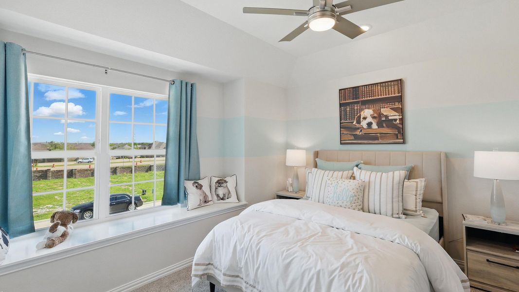 Sophisticated bedroom boasts plush textures, expansive window, and tranquil views in Green Oaks Preserve. Sophisticated bedroom boasts plush textures, expansive window, and tranquil views in Green Oaks Preserve.