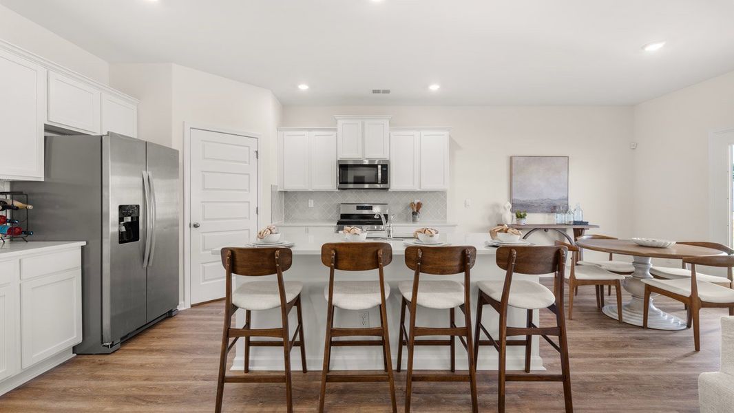 Furnished interior in a model home at Preserve at Dove Creek in Statham (Image 8).