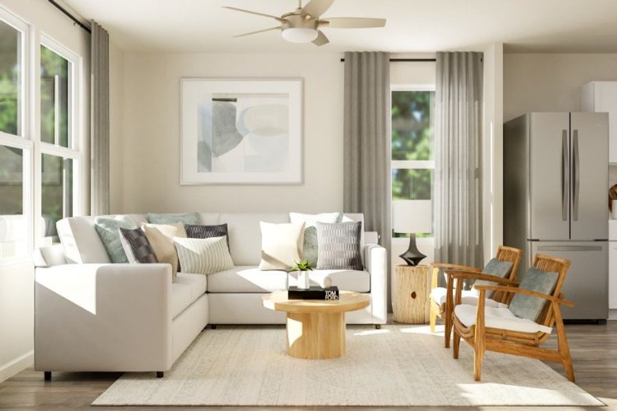 A living room with a white couch and a table. A living room with a white couch and a table.