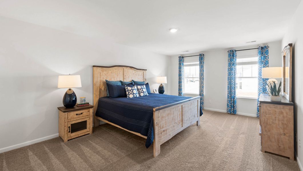 Furnished interior in a model home at Paddock Point in Roebuck (Image 17).