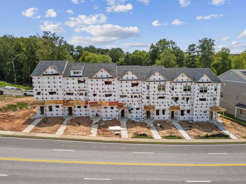 Aerial view of the Towns at Enclave community in Lawrenceville, GA, showing layout and nearby surroundings (Image 14). Aerial view of the Towns at Enclave community in Lawrenceville, GA, showing layout and nearby surroundings (Image 14).