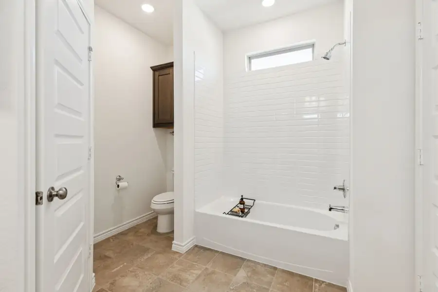 Furnished interior in a model home at Eagle Cove in Denton (Image 24).