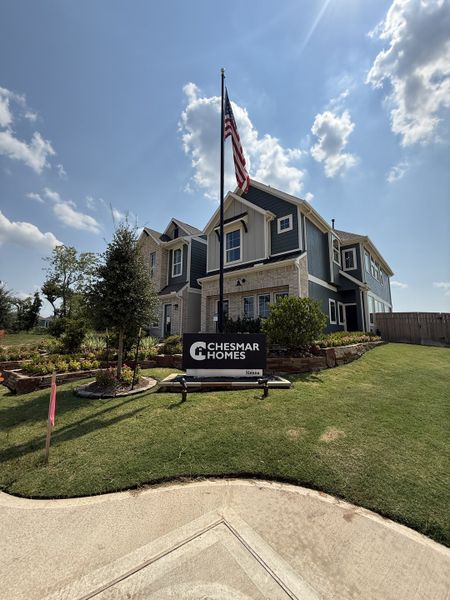 A beautiful two-story home with neat landscaping and a flagpole in Sienna by Chesmar Homes (Missouri City, TX). A beautiful two-story home with neat landscaping and a flagpole in Sienna by Chesmar Homes (Missouri City, TX).