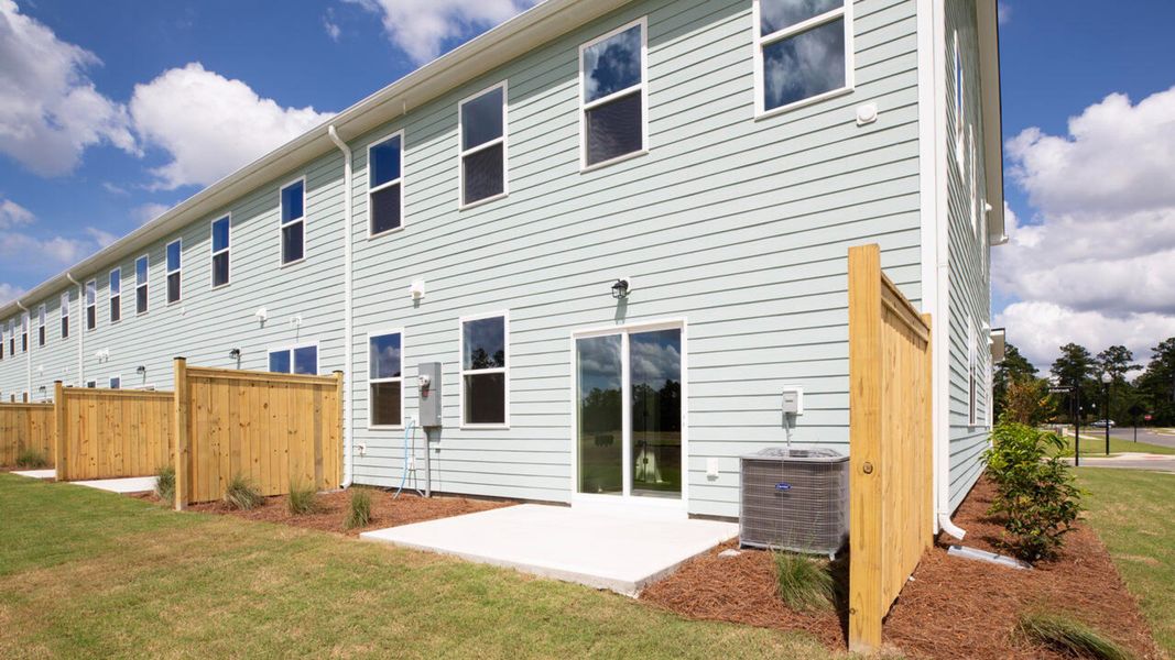 Front exterior of a home in the Indigo Preserve Townhomes community, located in Leland, NC (Image 9).