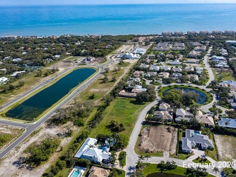 Aerial view of the The Strand community in Vero Beach, FL, showing layout and nearby surroundings (Image 65).