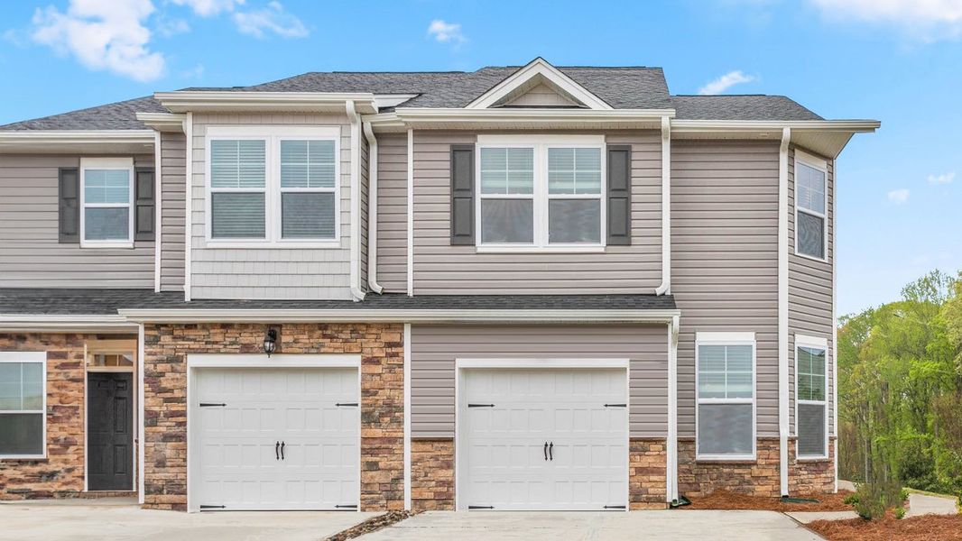 Front exterior of a home in the The Gables at Edinborough Townes community, located in Gibsonville, NC (Image 1).