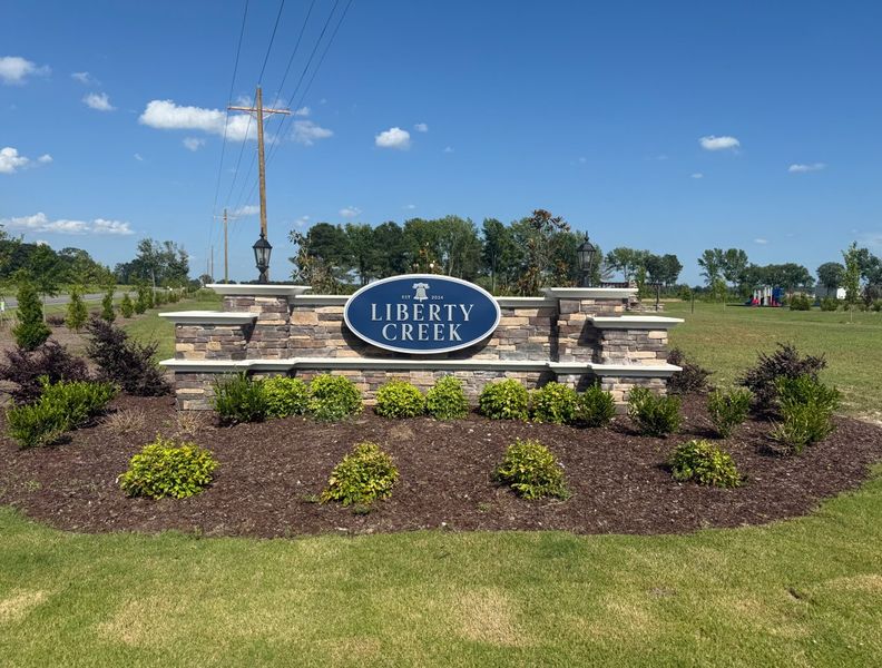Entrance to the Liberty Creek community in Smithfield, NC, featuring signage and landscaping (Image 1). Entrance to the Liberty Creek community in Smithfield, NC, featuring signage and landscaping (Image 1).
