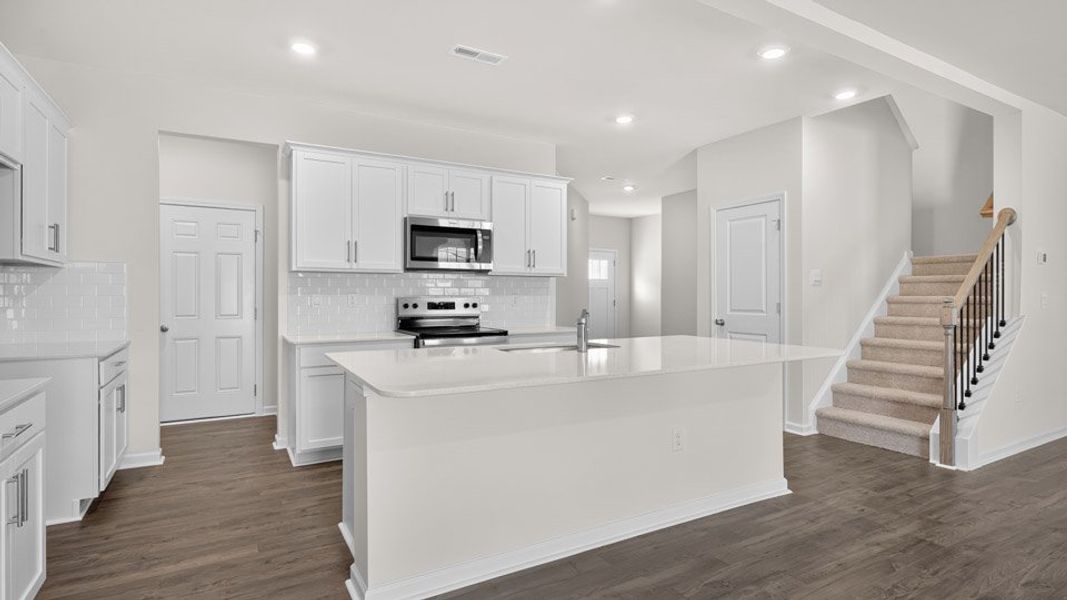 Furnished interior in a model home at The Grove at Matthews Landing in Fuquay Varina (Image 11).