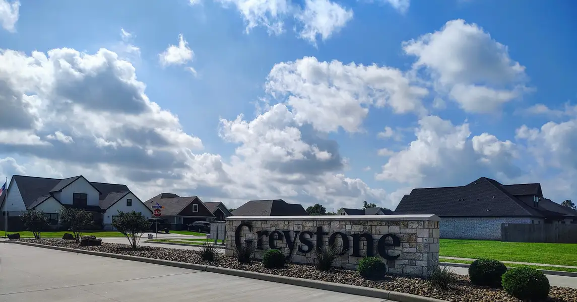 Entrance to the Greystone community in Angleton, TX, featuring signage and landscaping (Image 1).