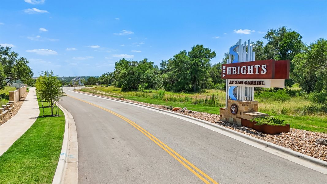 A road with a sign on it. A road with a sign on it.