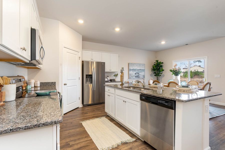 Furnished interior in a model home at Island Green in Myrtle Beach (Image 53).