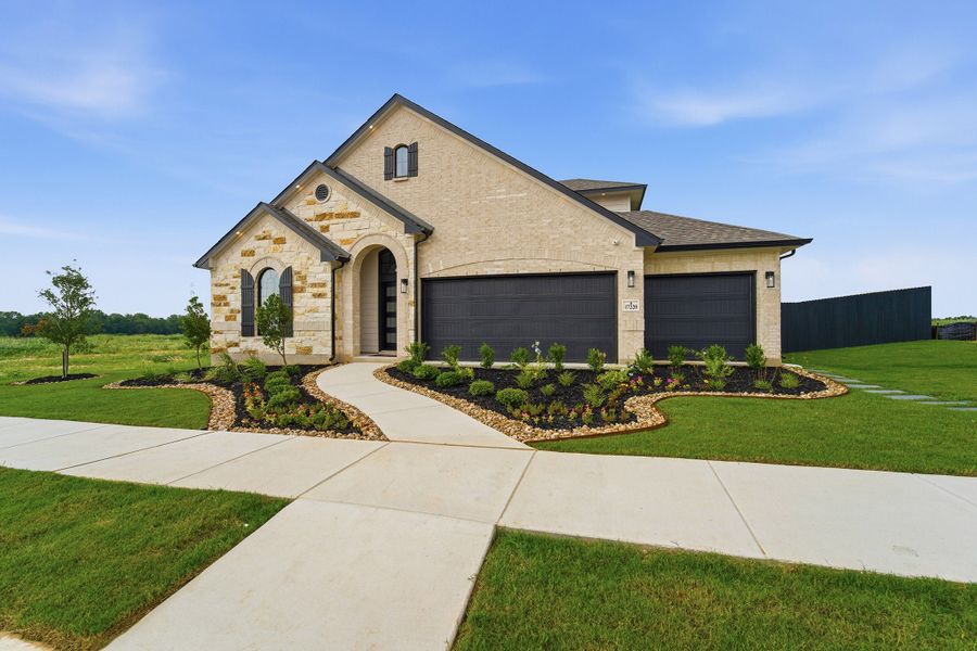 Front exterior of a home in the Hickory Ridge Estates community, located in Elmendorf, TX (Image 12).