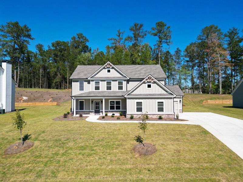 Front exterior of a home in the Woodland Hills community, located in Loganville, GA (Image 14).