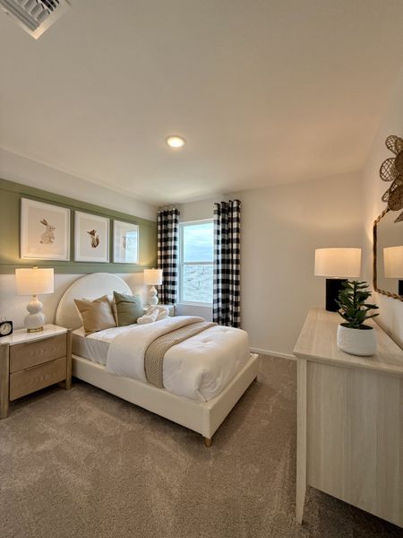 Cozy bedroom with checkered curtains, plush bedding, and nature-themed art for a serene atmosphere. Cozy bedroom with checkered curtains, plush bedding, and nature-themed art for a serene atmosphere.