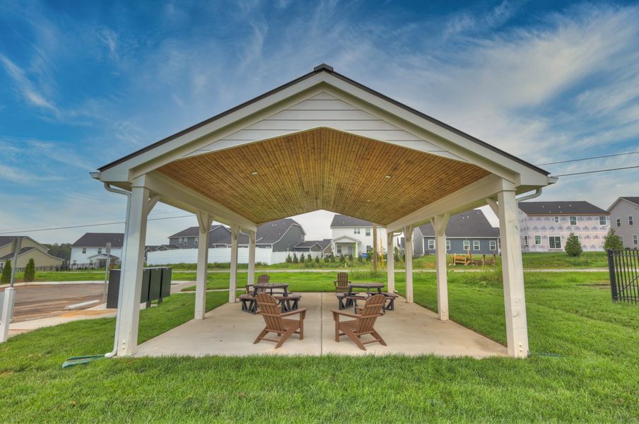 Helmsley Place 55+ Townhomes offers community amenities including a covered pavilion and dog park.