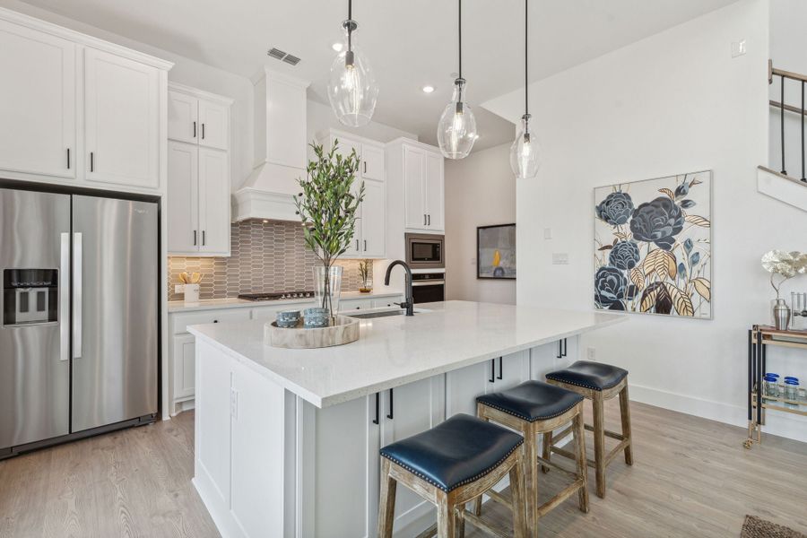 Furnished interior in a model home at Newman Village Townhomes in Frisco (Image 20).