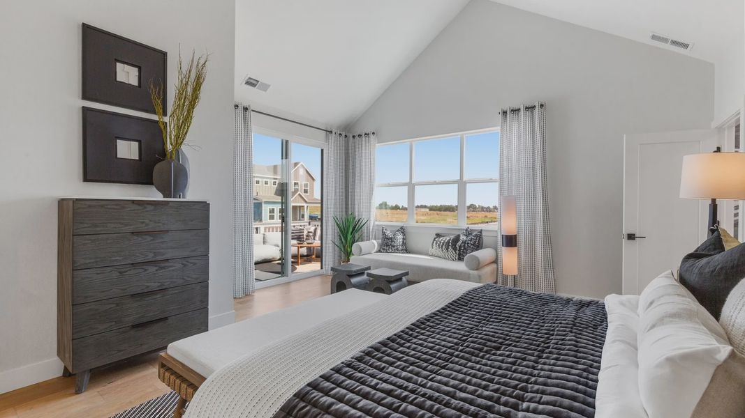 Elegant bedroom with vaulted ceiling, refined furnishings, expansive views, Dillon Pointe. Elegant bedroom with vaulted ceiling, refined furnishings, expansive views, Dillon Pointe.