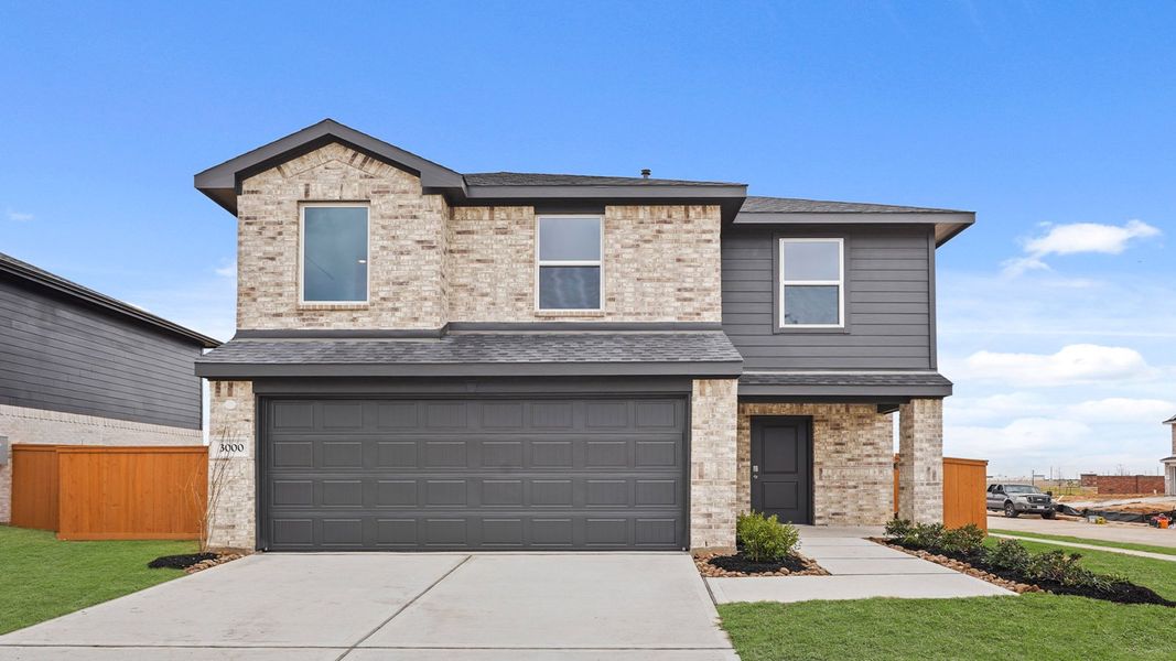 Front exterior of a home in the Sunterra community, located in Katy, TX (Image 13).