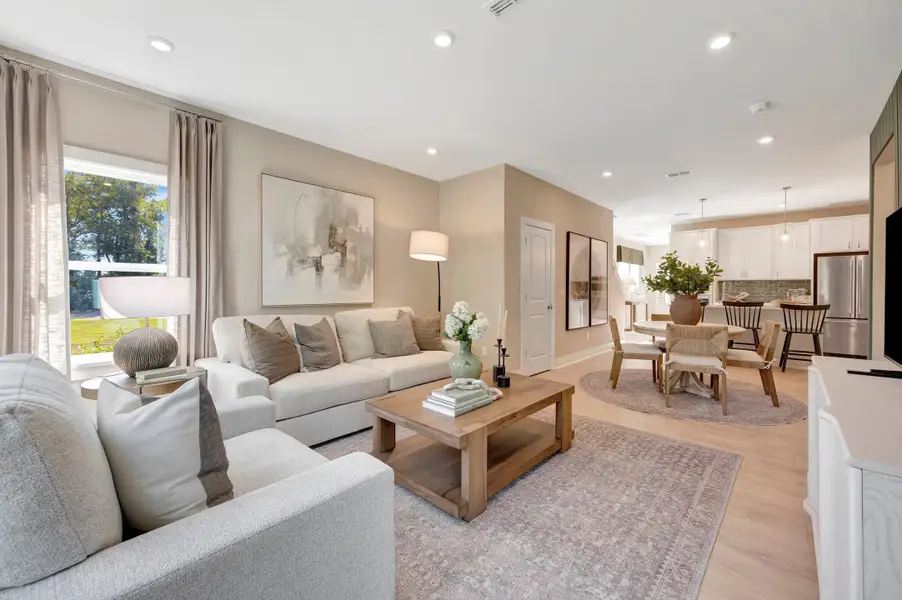 Furnished interior in a model home at Friendship Village Townhomes in Apex (Image 11).