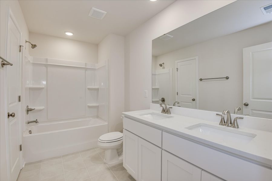 Furnished interior in a model home at Heritage Bay in Sumter (Image 38).