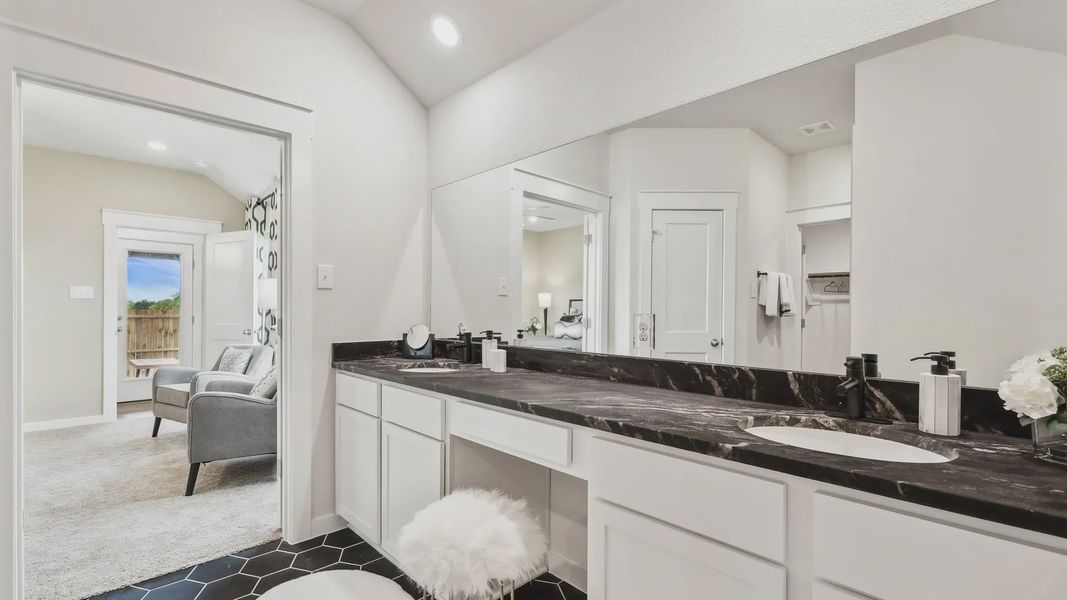 Indulge in elegance with a black marble countertop and sleek hexagonal tiles at Simpson Crossing.