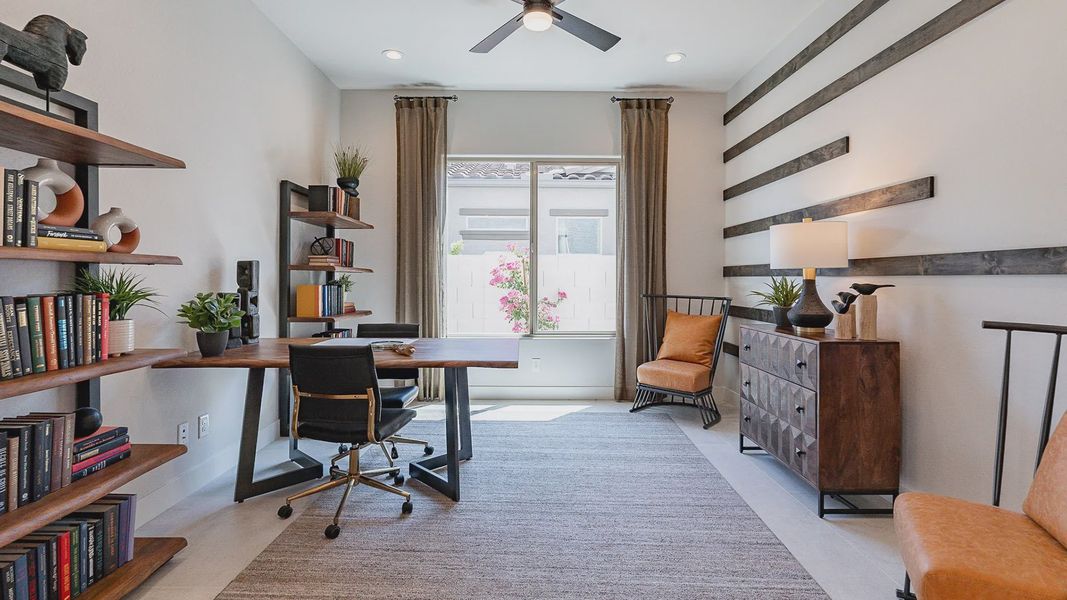 Exquisite office features custom wood accents, sleek furnishings, and designer lighting in Windrose.