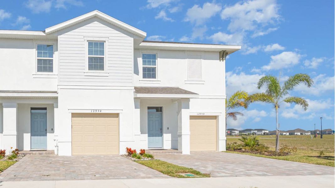 Front exterior of a home in the Central Park Townhomes community, located in Port St. Lucie, FL (Image 3).