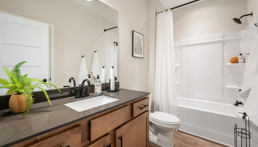 Furnished interior in a model home at Pinecrest Ridge in Dacula (Image 38).