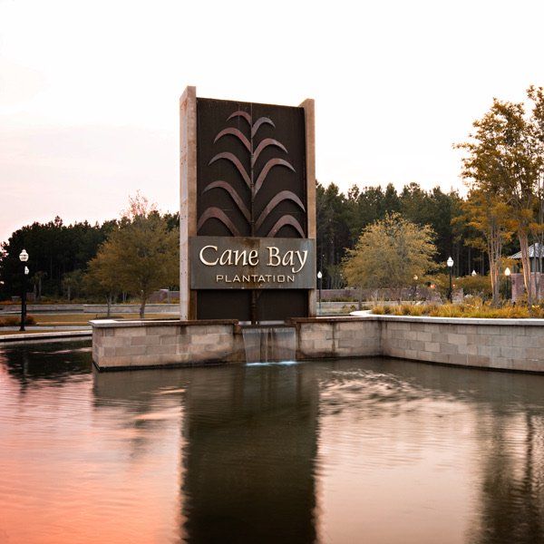 Main entrance to the Cane Bay Plantation master-planned community in Summerville, SC, featuring its landmark signage (Image 13).