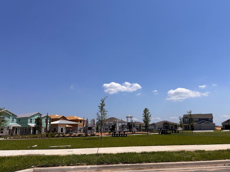 A vibrant new development in Wellness Ridge: Manor Collection by Lennar with modern homes and a serene park setting (Clermont, FL).