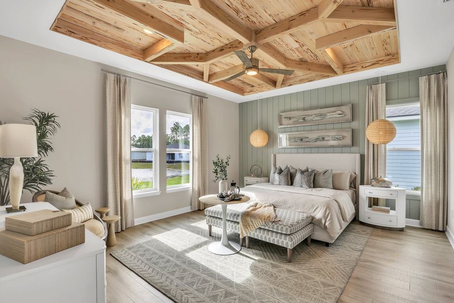 Master bedroom with wood coffered ceiling, shiplap accent wall, hardwood floors, and ceiling fan