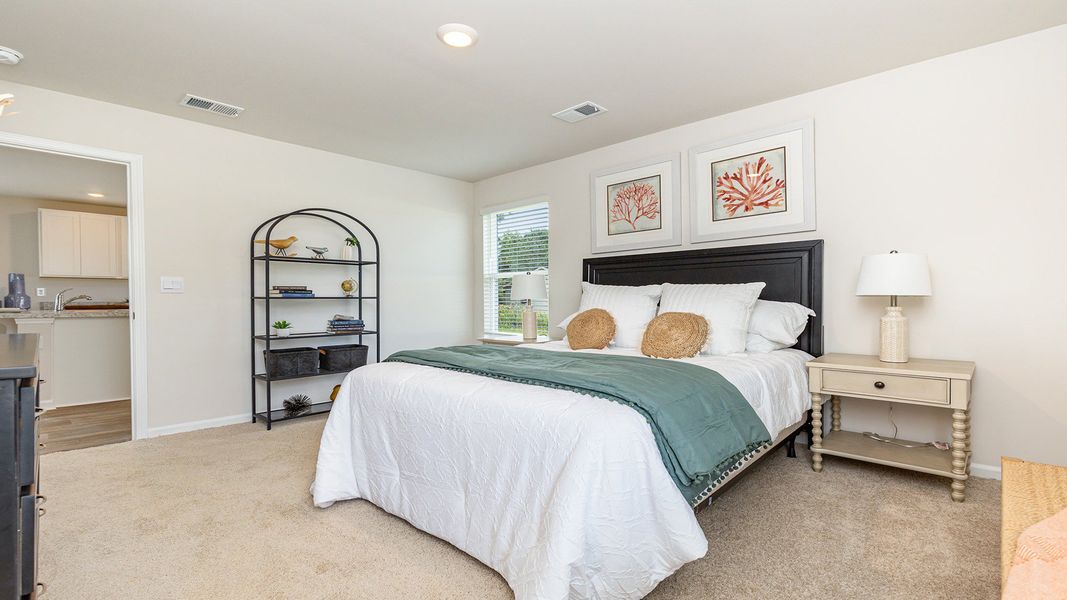 Furnished interior in a model home at Silver Oaks in Ocean Isle Beach (Image 14).