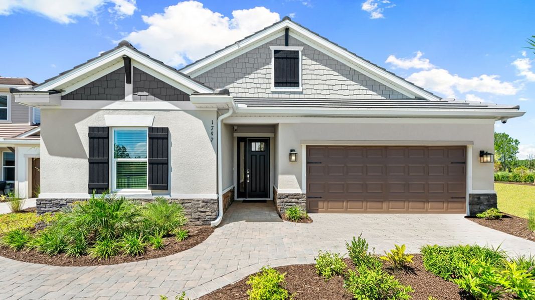 Front exterior of a home in the Hammock at Two Rivers community, located in Zephyrhills, FL (Image 5). Front exterior of a home in the Hammock at Two Rivers community, located in Zephyrhills, FL (Image 5).