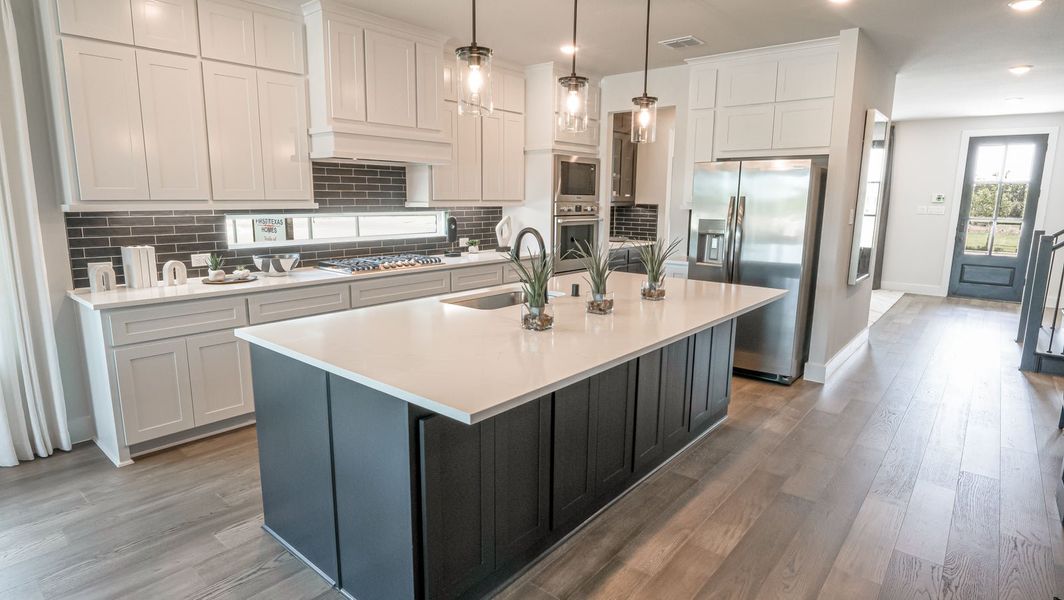 Furnished interior in a model home at Trails at Cottonwood Creek in Rowlett (Image 3). Furnished interior in a model home at Trails at Cottonwood Creek in Rowlett (Image 3).