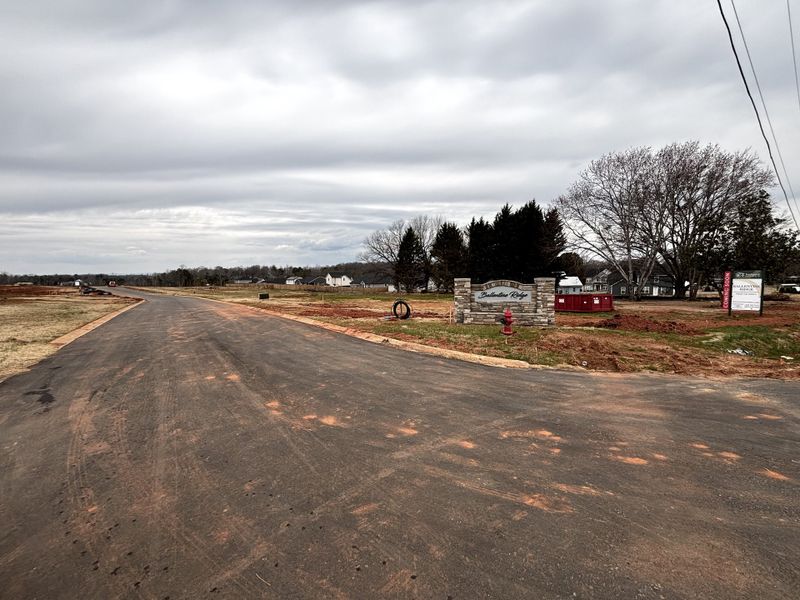Entrance to the Ballentine Ridge community in Lyman, SC, featuring signage and landscaping (Image 12). Entrance to the Ballentine Ridge community in Lyman, SC, featuring signage and landscaping (Image 12).