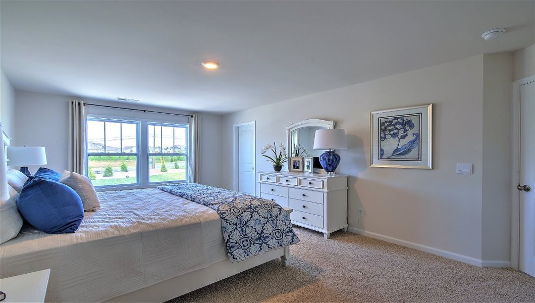 Furnished interior in a model home at Townes at Tap Root Farms in Fletcher (Image 11).