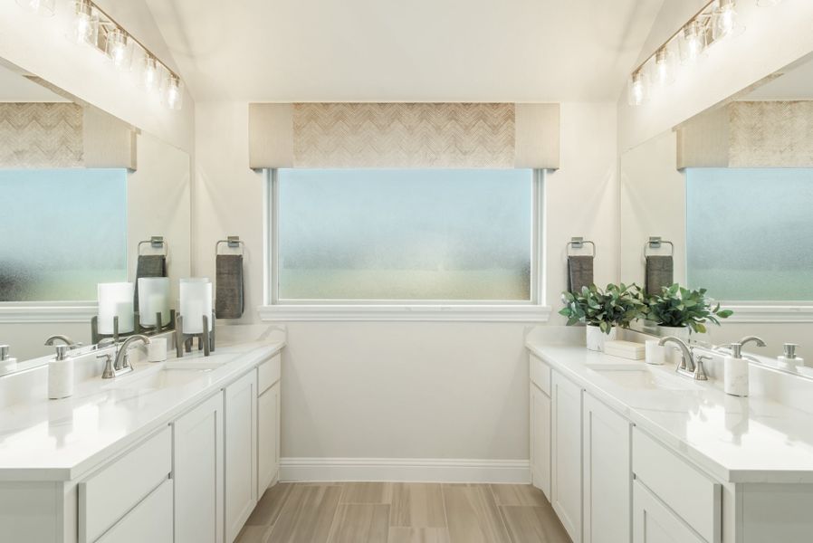 Bathroom with dual vanities, white cabinets, quartz countertops, and a frosted privacy window