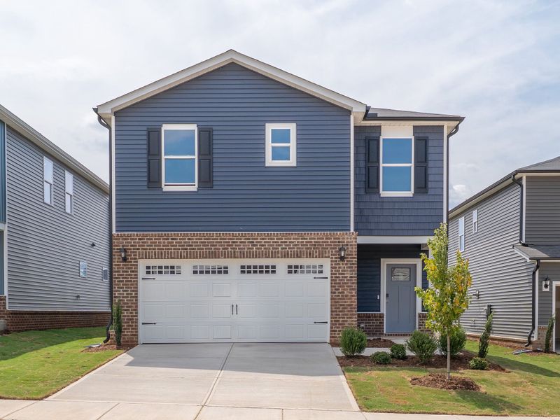 Front exterior of a home in the Oak Manor - Classic Series community, located in Garner, NC (Image 2).