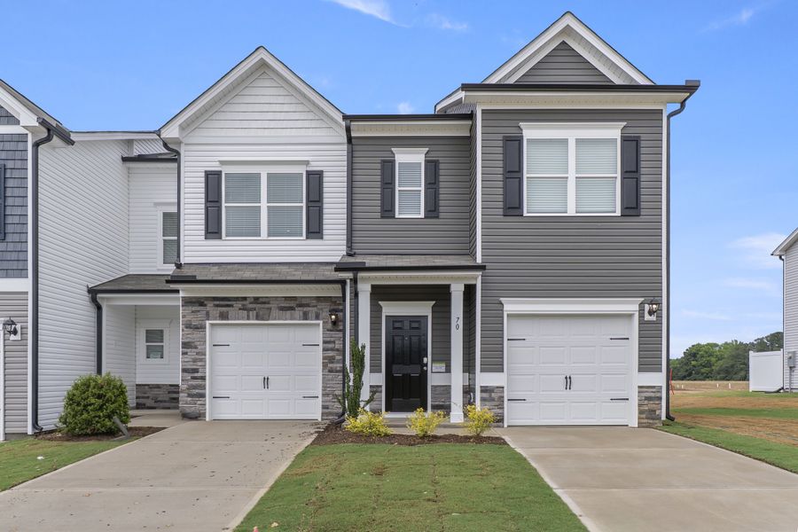 Front exterior of a home in the The Townes at Cape Overlook community, located in Lillington, NC (Image 12). Front exterior of a home in the The Townes at Cape Overlook community, located in Lillington, NC (Image 12).