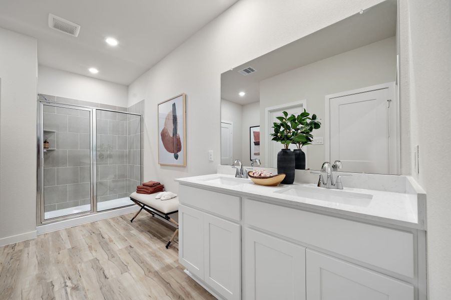 A bathroom with a sink and a shower. A bathroom with a sink and a shower.