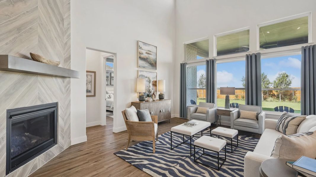 Revel in Ridge Crossing's high ceilings, vast windows, and chic fireplace in this elegant Texas living space. Revel in Ridge Crossing's high ceilings, vast windows, and chic fireplace in this elegant Texas living space.