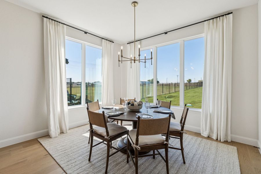 Furnished interior in a model home at Settler's Glen in New Fairview (Image 13).