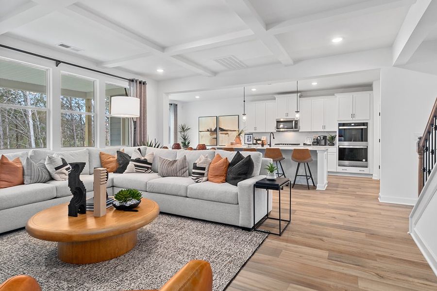 A living room with a couch and a table. A living room with a couch and a table.