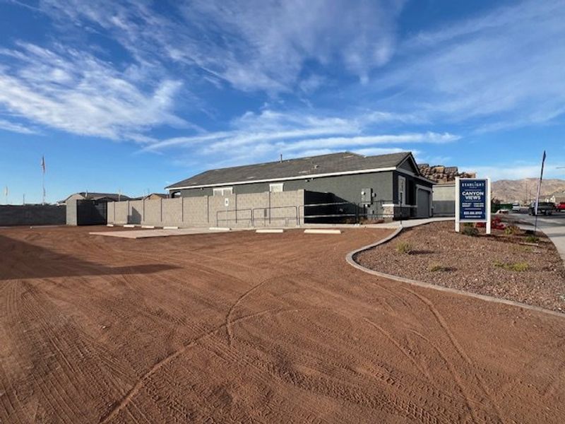 A modern home with a spacious yard in Canyon Views by Starlight Homes (Litchfield Park, AZ).