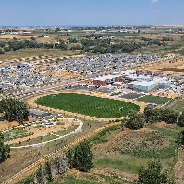 Aerial view of the Thompson River Ranch community in Johnstown, CO, showing layout and nearby surroundings (Image 1). Aerial view of the Thompson River Ranch community in Johnstown, CO, showing layout and nearby surroundings (Image 1).
