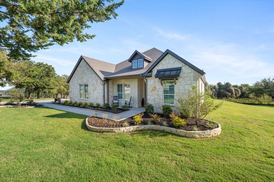 Front exterior of a home in the Oak Grove Addition community, located in Springtown, TX (Image 9).