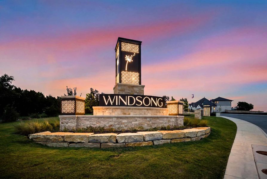 Entrance to the Windsong - Reserve Series community in Boerne, TX, featuring signage and landscaping (Image 12). Entrance to the Windsong - Reserve Series community in Boerne, TX, featuring signage and landscaping (Image 12).
