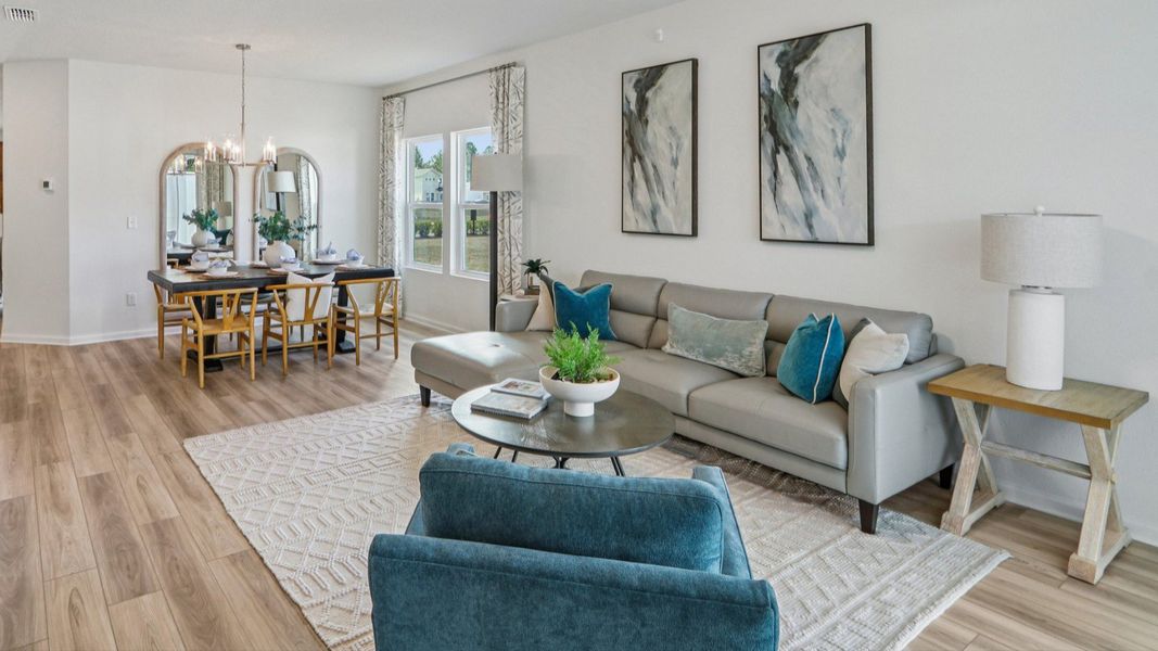 Discover refined elegance with sleek furnishings and abundant natural light in Panther Creek's luxurious living area. Discover refined elegance with sleek furnishings and abundant natural light in Panther Creek's luxurious living area.